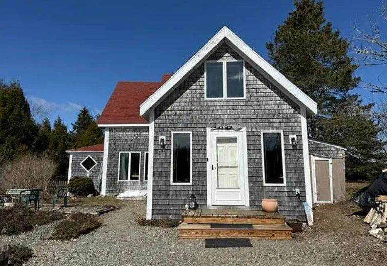 Has apple trees and a thyme lawn. Almost seven acres in Maine. $285,900