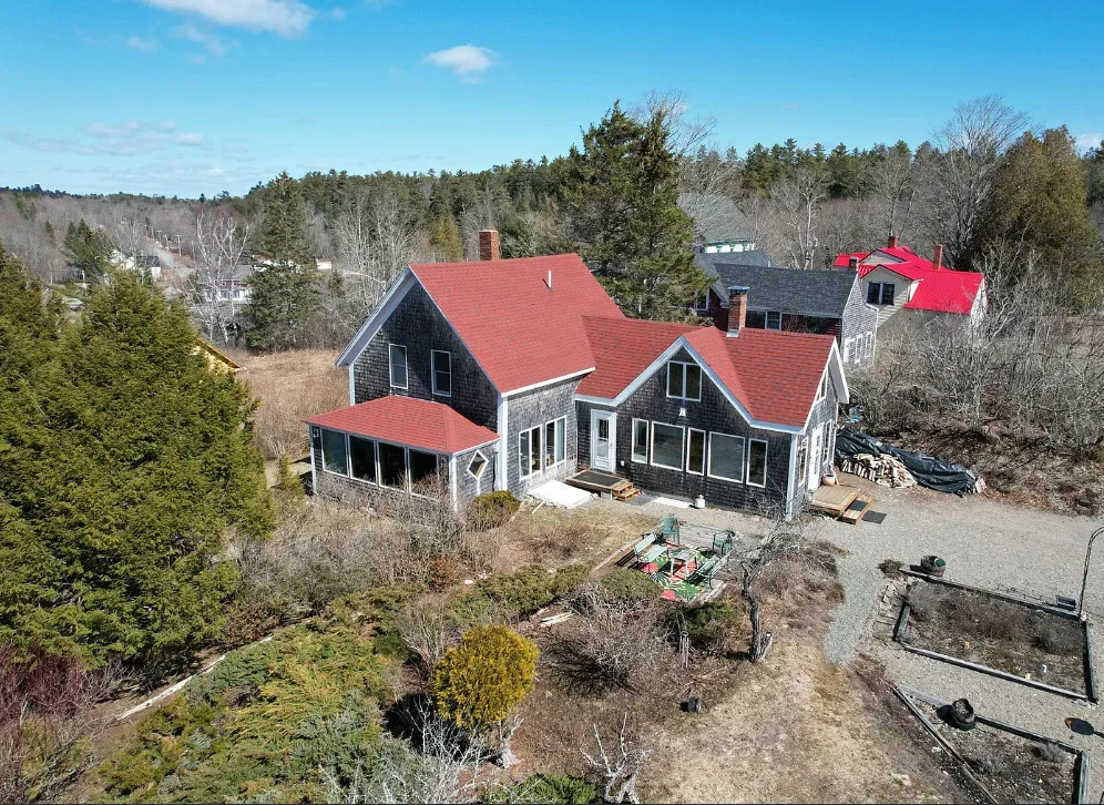 Has apple trees and a thyme lawn. Almost seven acres in Maine. $285,900