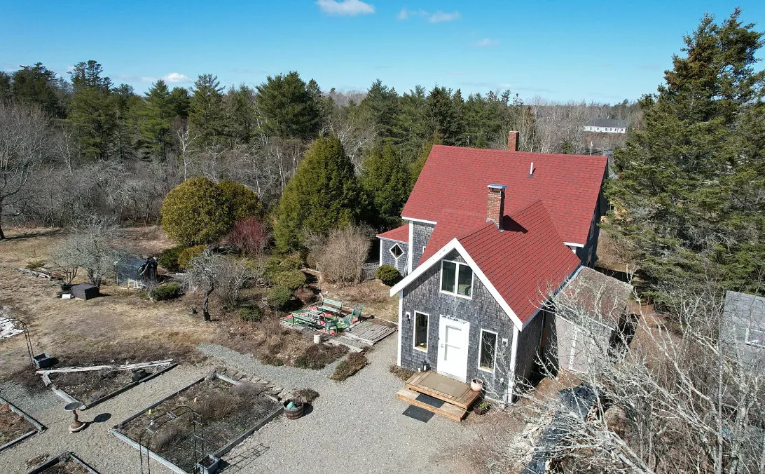 Has apple trees and a thyme lawn. Almost seven acres in Maine. $285,900