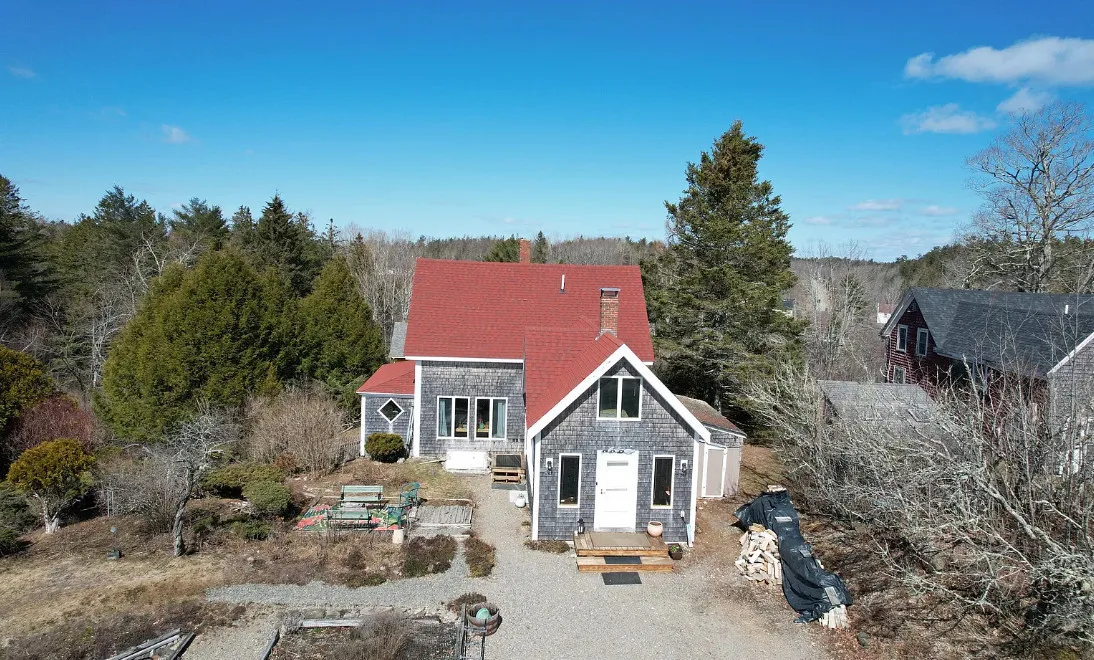 Has apple trees and a thyme lawn. Almost seven acres in Maine. $285,900
