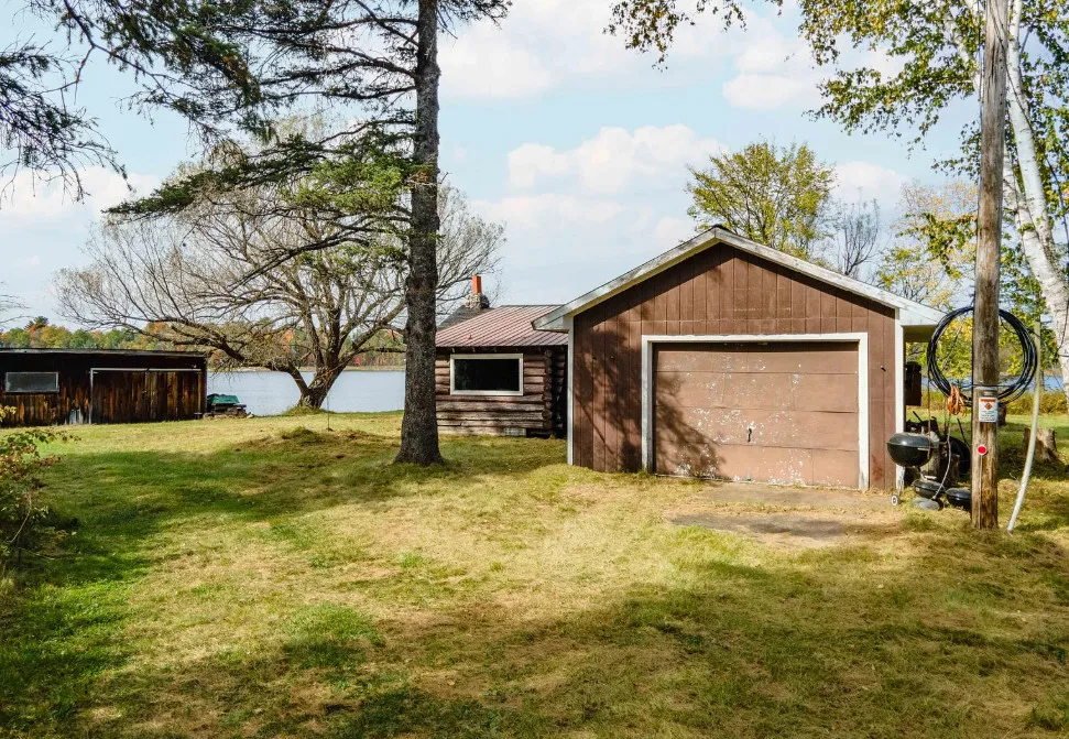 Waterfront in Michigan! Love that stone chimney! C. 1950.