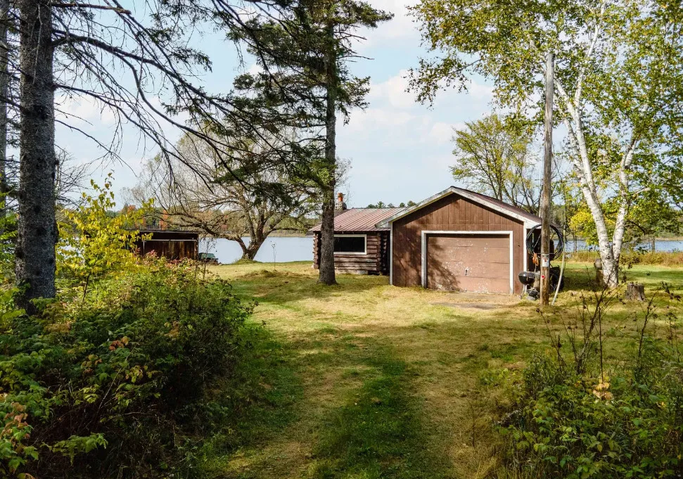 Waterfront in Michigan! Love that stone chimney! C. 1950.