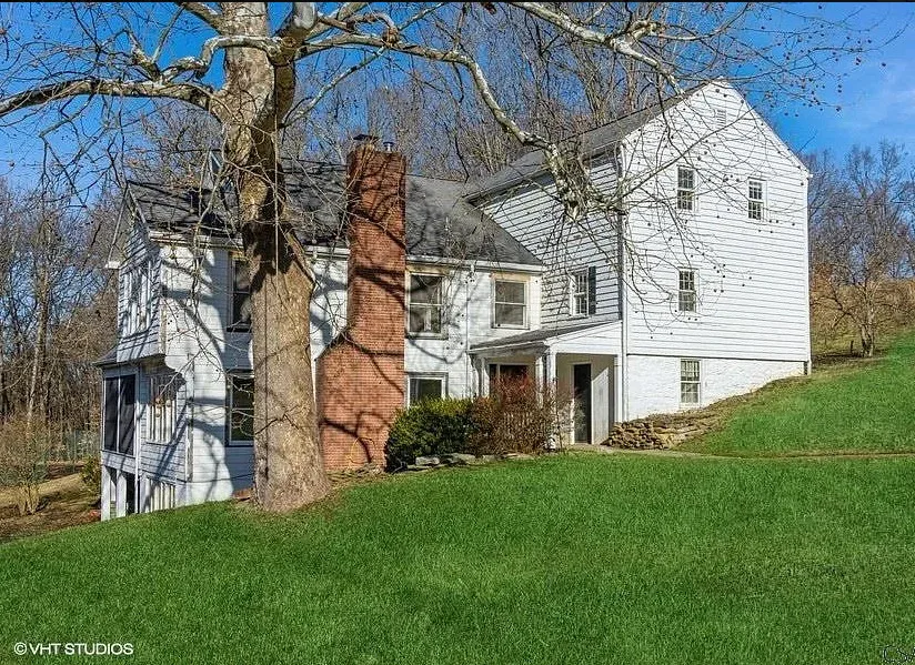 Tennis court and a pool! Huge fireplace! Eight acres in Pennsylvania. $354,900