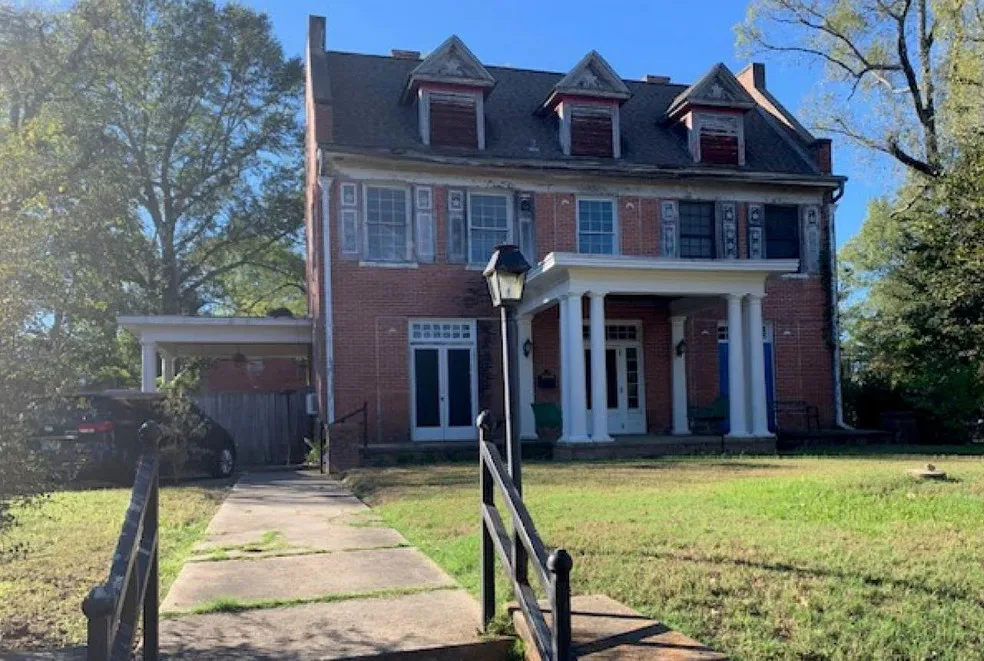 Nice sinks and pocket doors! Circa 1912 in Arkansas. $149,900