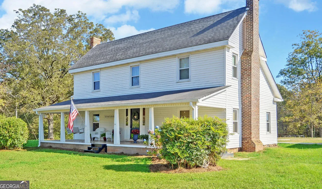 Classic looking farmhouse! Over three acres in Georgia with a huge workshop! 