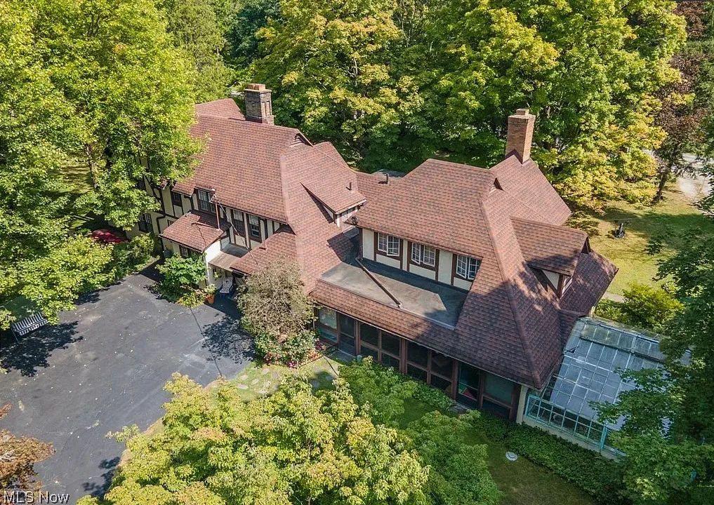 Deal of the Day! Love the private bridge and greenhouse! Over three acres in Ohio