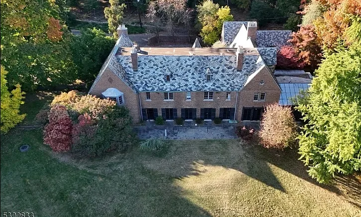 Has an indoor pool! 18 bedrooms/14 bathrooms. Almost six acres in New Jersey. 