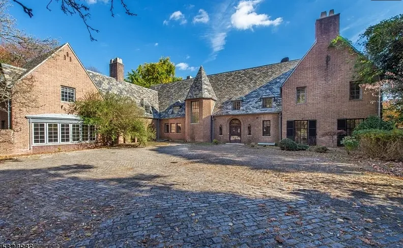 Has an indoor pool! 18 bedrooms/14 bathrooms. Almost six acres in New Jersey. 