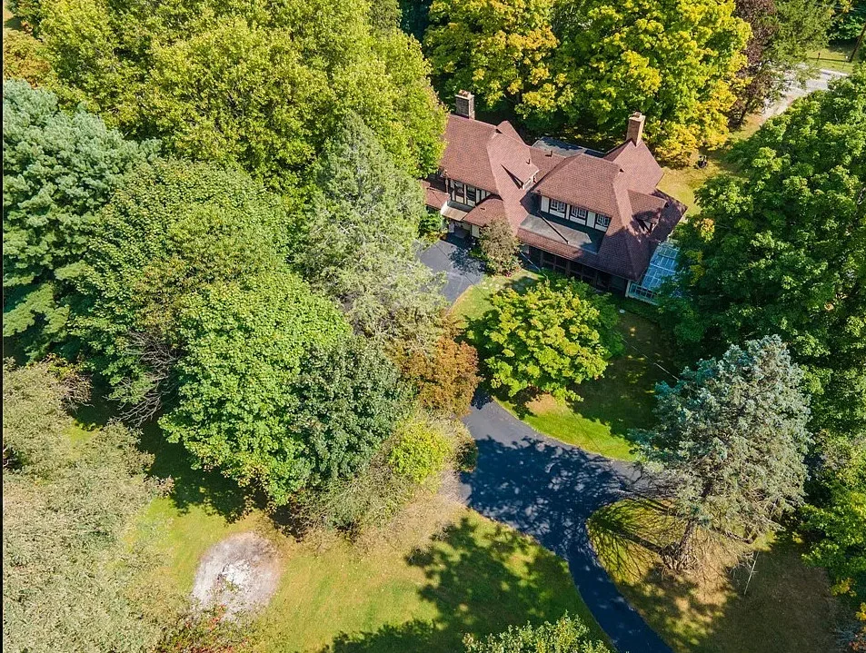 Deal of the Day! Love the private bridge and greenhouse! Over three acres in Ohio