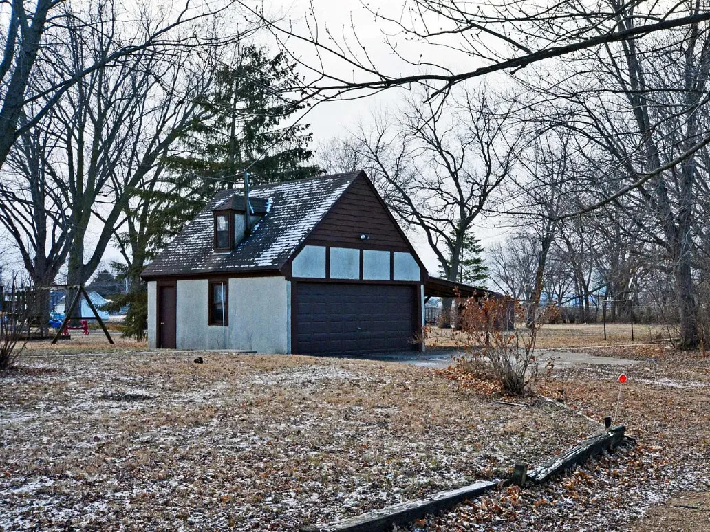 Tudor style home on one acre in Minnesota. C. 1936. $199,900