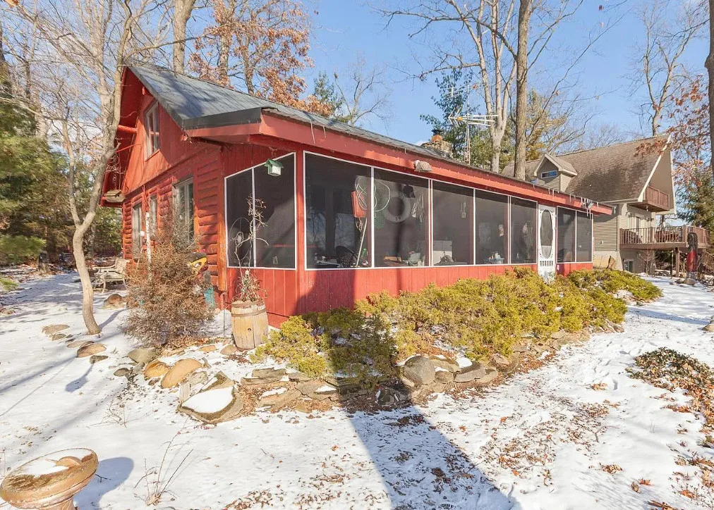 Lakefront cabin in Michigan! That lake looks mighty chilly! $275,000
