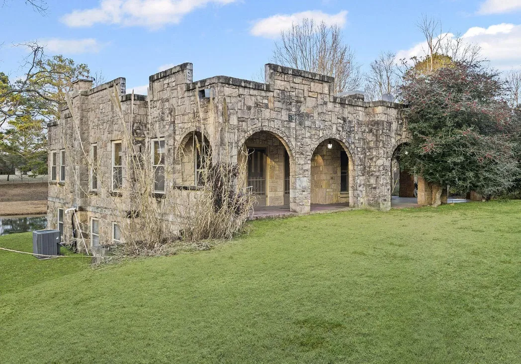 Like a little castle! Almost four acres in Alabama with a pond. $265,000