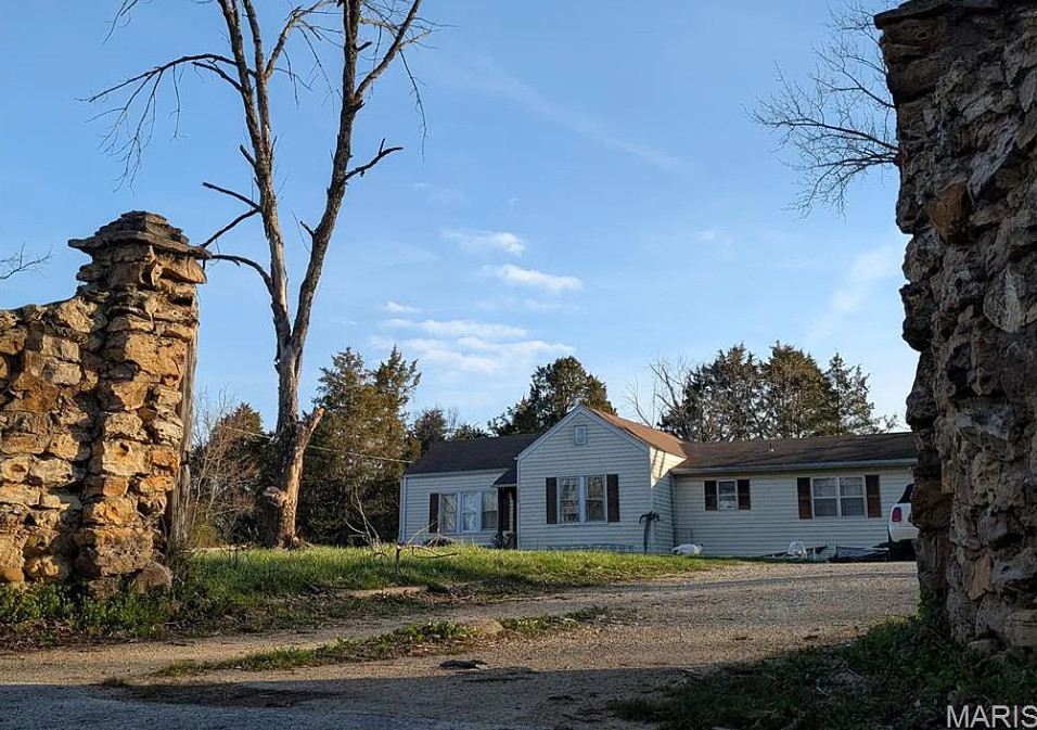 That stone fireplace! Diamond in the Rough! Four acres in Missouri.