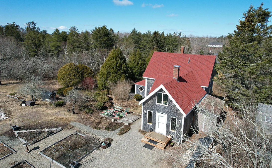 Has apple trees and a thyme lawn. Almost seven acres in Maine.